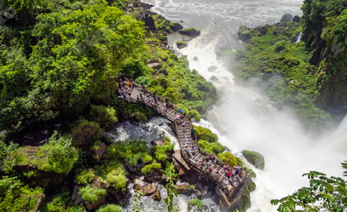 Preview: Tourists on terrace near waterfall