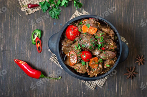 Preview: Roast turkey liver with vegetables in a pot.