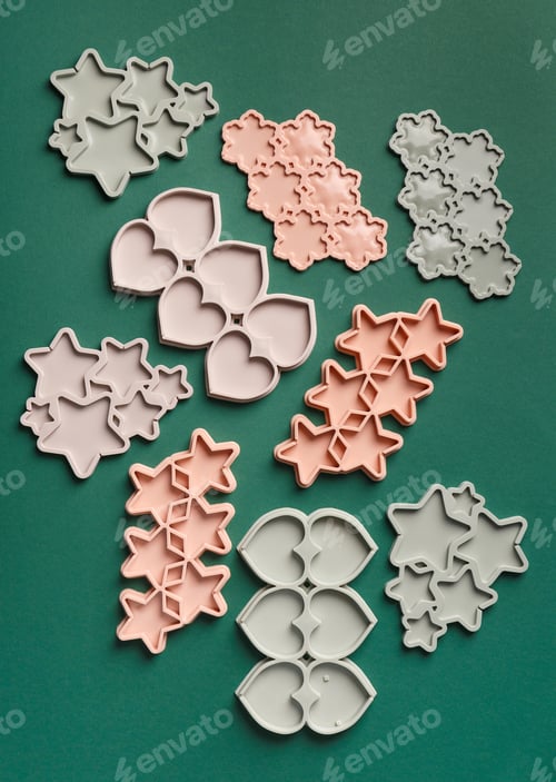 Preview: Silicone molds for making chocolate, lollipops, sweets on a green background, top view.