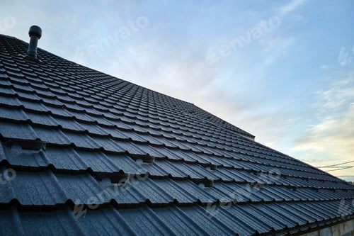 Preview: Snow guard for safety in winter on house roof top covered with ceramic shingles.
