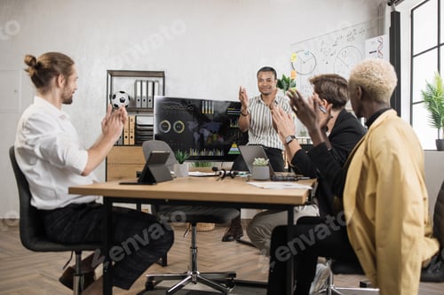 Preview: Businessmen with modern gadgets on table celebrating successful completion of project.
