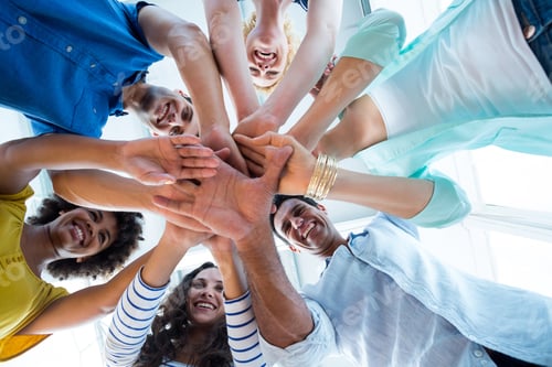 Preview: Creative Team Putting Their Hands Together In Circle