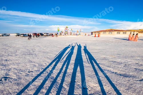Preview: Shadow of four people on white surface