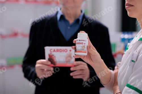 Preview: Pharmaceutical assistant and elderly customer examining hear medication boxes