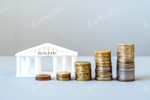 Preview: Model of a bank building with growing stacks of coins, financial growth