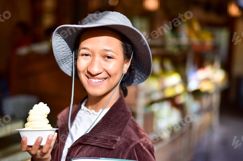 Preview: Young Teen Girl smiling big while enjoying a tasty summer treat