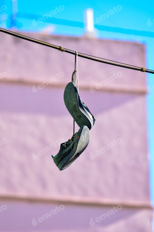 Preview: sneakers on an electric wire