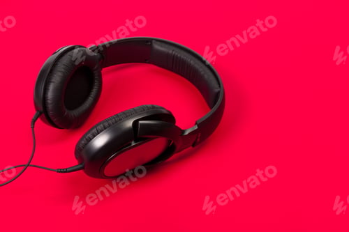Preview: headphones on red surface