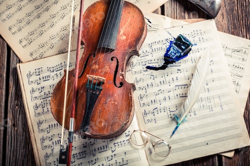 Preview: Retro musical sheets and violin with ink and feather