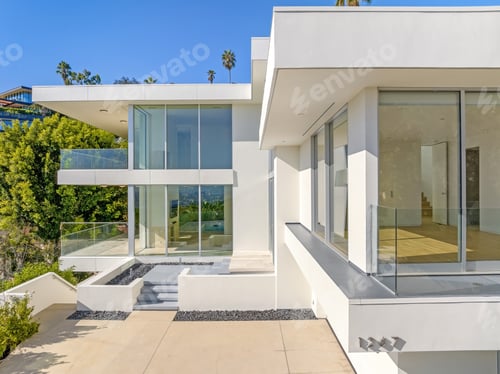 Preview: Modern house surrounded by lush greenery with numerous windows