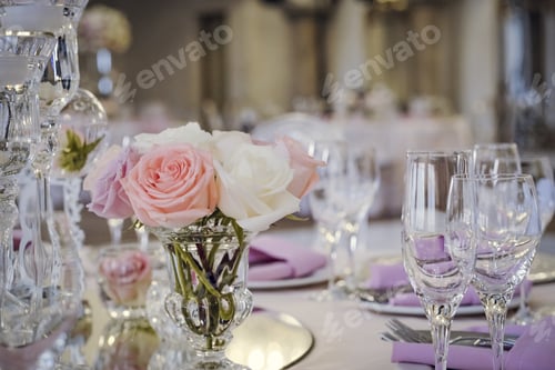 Preview: Closeup shot of a centerpiece on the table with wine glasses and a blurred background