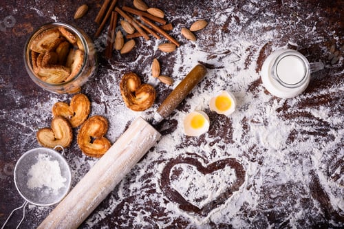 Preview: top view of tasty homemade cookies and ingredients on table top