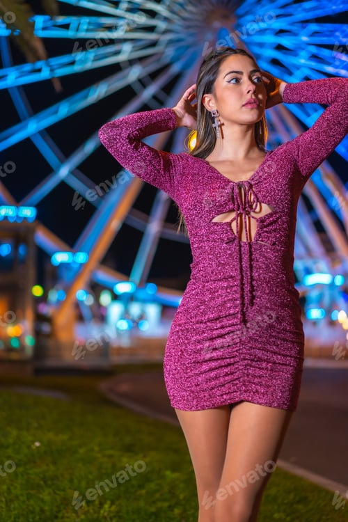 Preview: Christmas in the city at night, decoration in winter. Young brunette smiling on an illuminated