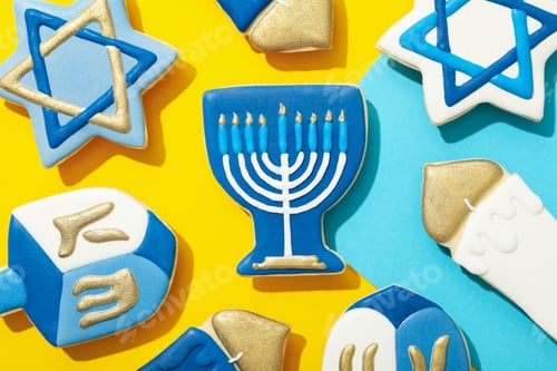 Preview: Gingerbread cookies with Jewish signs on yellow background, top view
