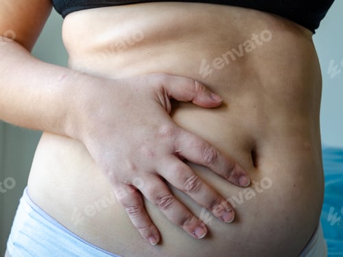 Preview: closeup on woman belly, overweight adiposity, fat, real body, seen by side