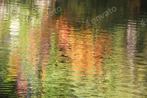 Preview: Reflection of Fall Colors From Changing Trees Leaves on the Lake