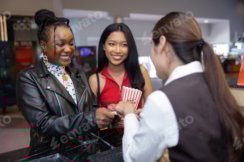 Preview: Female Buying movie ticket from Cinema ticket seller counter