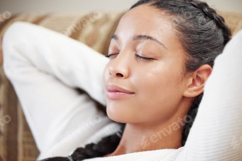 Preview: The more calm, the clearer the mind. Shot of a young woman relaxing on the sofa at home.