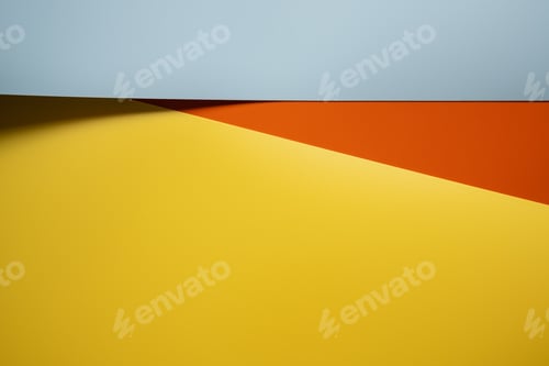 Preview: Abstract background in yellow, red and gray colors with shadow. Copy space. Top view.