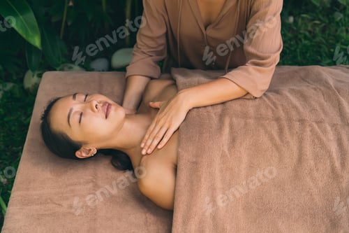 Preview: Asian female enjoying sunday for dayspa with professional cosmetologist and masseur