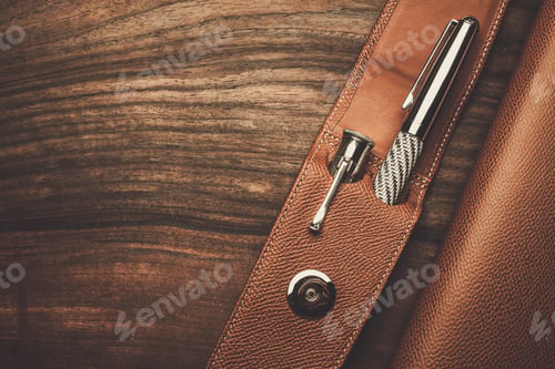Preview: Close-up of Pen, Screwdriver, and Leather Case