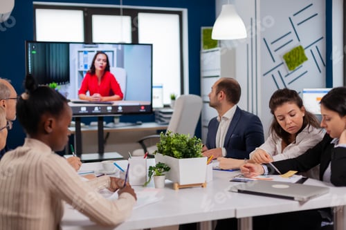 Preview: Manager woman sitting in front of camera talking on video call