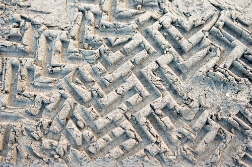 Preview: Close up of tire tracks on the dirty sand