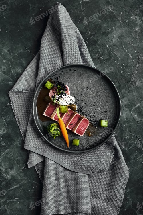 Preview: Tuna tagliata in vegetables stewed carrots and peppers, Beautiful serving, traditional Italian