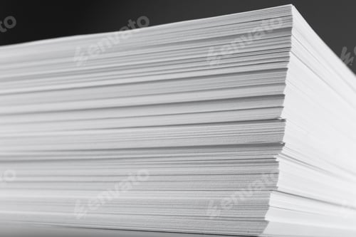 Preview: Stack of blank white paper on grey background, closeup