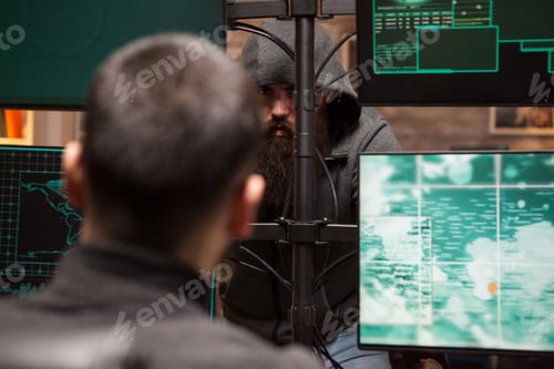 Preview: Cropped image of bearded hacker organise a cyber attack