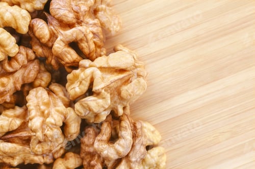 Preview: Close up picture of walnuts on a wooden background
