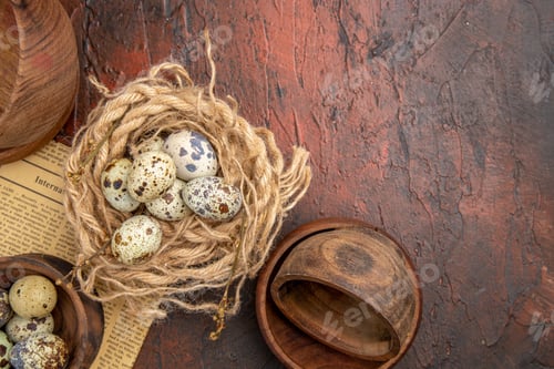 Preview: Above view of fresh eggs from a basket with towel and old newspaper wooden pots on a brown