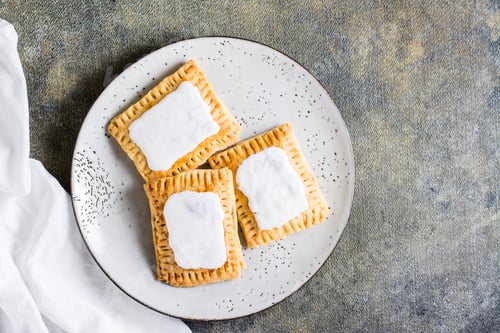Preview: Homemade glazed pop tarts on a plate. American pastry. Top view