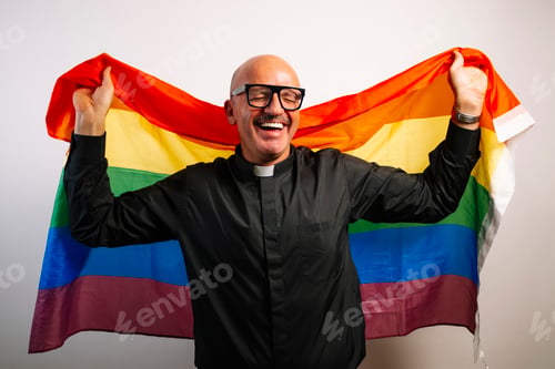 Preview: Portrait of a priest with a multi-colored LGBT flag.