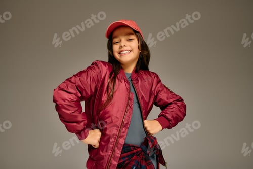 Preview: Joyful little child celebrating Christmas spirit with a bright smile in 2025