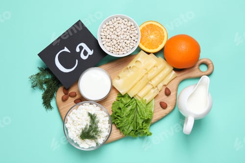Preview: Food high in calcium. Flat lay composition with different products on turquoise background