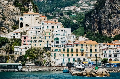 Preview: ld and colorful houses built on the side of a hill in Sorrento