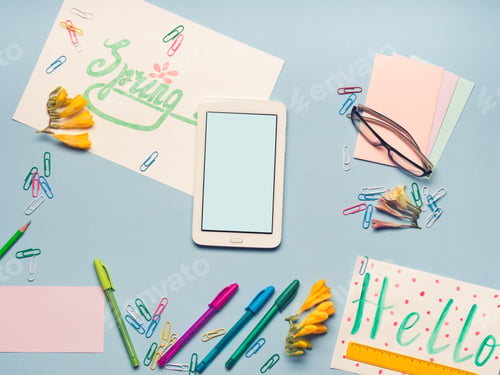 Preview: Blue flat lay with gadget stationery glasses spring lettering