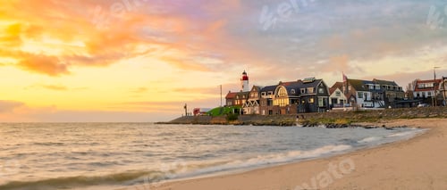 Preview: Urk Flevoland Netherlands sunset at the lighthouse and harbor of Urk Holland. Fishing village Urk