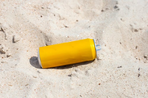Preview: Yellow can waste on the beach