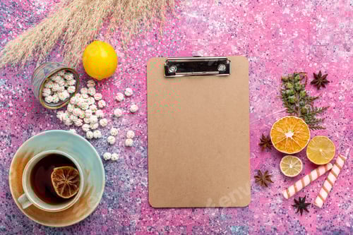 Preview: top view cup of tea with white sweet confitures and fresh lemon on pink background candy sugar sweet