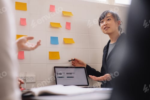 Preview: Female executive giving presentation