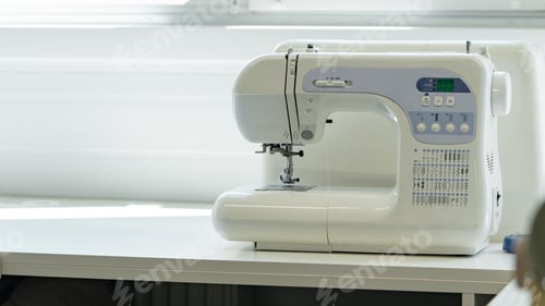 Preview: Sewing machine on a table near a bright window during the afternoon light
