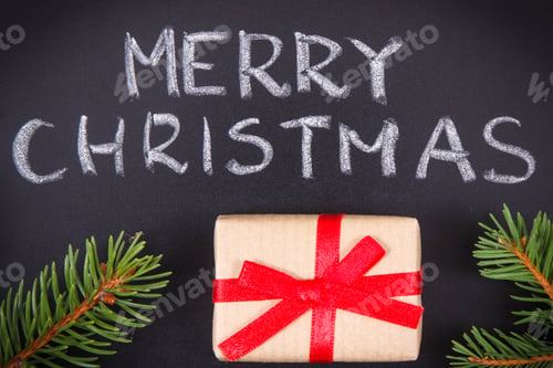Preview: Inscription Merry Christmas, wrapped gift with ribbon and spruce branches