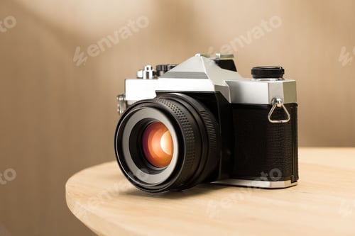 Preview: A vintage film camera sits elegantly on a table.