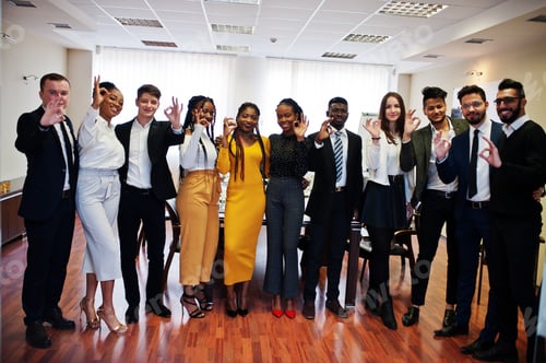 Preview: Multiracial young creative people in modern office
