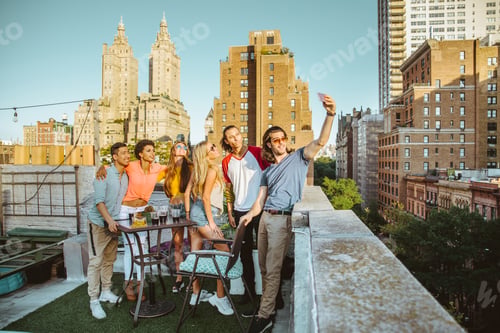 Preview: Group of friends having party on a rooftop