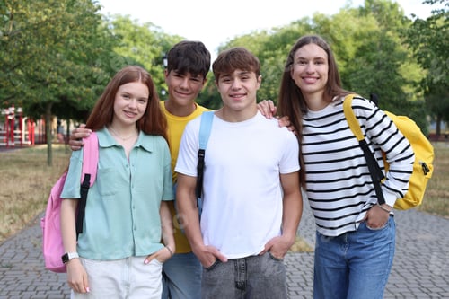 Preview: Group of teenagers spending time together in park