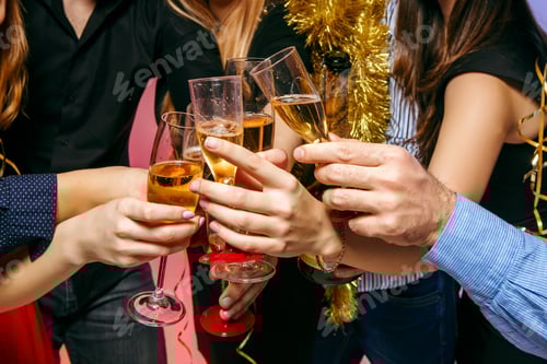 Preview: Many young women and men drinking at christmas party