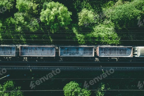 Preview: Aerial view of Railway railroad tracks and cargo train through countryside